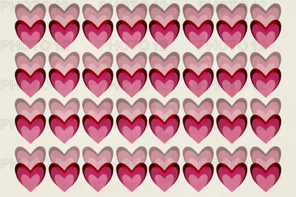 A seamless pattern of overlapping hearts in vibrant shades of pink and red, creating a playful and romantic aesthetic against a light background