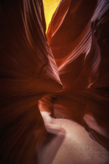 Explore the enchanting curves and colors of Antelope Canyon in the USA. This narrow slot canyon showcases flowing sandstone formations, illuminated by soft, natural light
