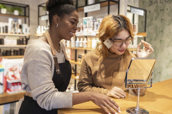 A employee in a cosmetics store help a customer with makeup. She is focused on providing excellent service, showcasing various beauty products in a friendly environment
