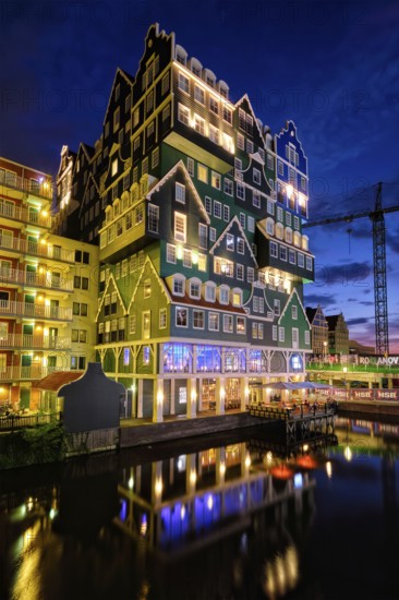 ZAANDAM, NETHERLANDS, MAY 21, 2018: Inntel Hotel in Zaandam illuminated at night. Design of 12-storey tall building opened in 2009 is the result of stacking a series of traditional Dutch houses