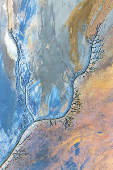 Abstract fractal work featuring dynamic patterns in vibrant blues, oranges, and earth tones. The flowing design evokes natural landscapes and imaginative dream scapes