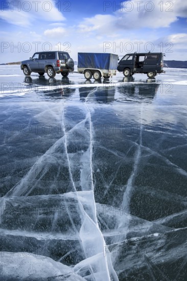 Cars on ice, Lake Baikal, Olkhon Island, Pribaikalsky National Park, Irkutsk Province, Siberia, Russia