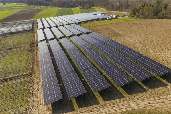 Large-scale solar system on arable land with adjacent trees and fields, Agri PV Bau für Landwirtschaft, Enzkreis, Germany
