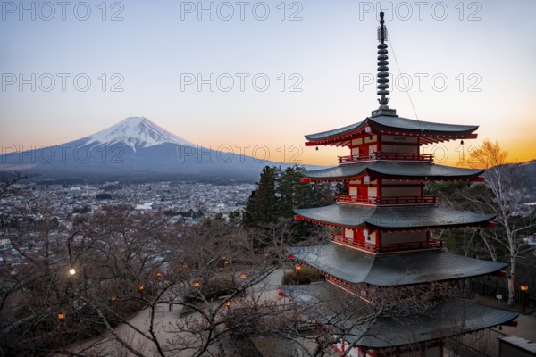 Five-story pagoda of a Shinto Shrine, Chureito Pagoda, with views of Fujiyoshida City and Mount Fuji volcano at sunset, Arakura Fuji Sengen Shrine, Arakurayama Sengen Park, Yamanashi Prefecture, Japan