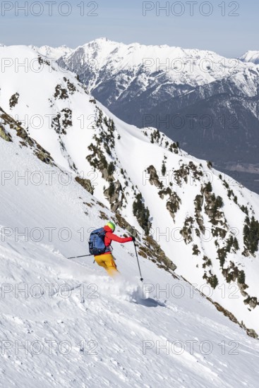 Ski tourers on the descent, peaks and mountains in winter, Sellraintal, Kühtai, Tyrol, Austria