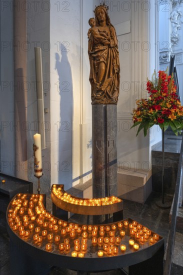 Sculpture of the Virgin Mary in front of sacrificial candles, St Kilian's Cathedral, Würzburg, Lower Franconia, Bavaria, Germany