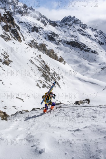 Mountaineer with skis at the fork Porta d'Es-cha, ski tour Bündner Haute Route, Albula Alps, Rhaetian Alps, Grisons, Eastern Switzerland, Switzerland