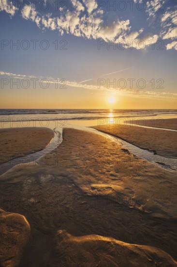 Atlantic ocean sunset with surging waves at Fonte da Telha beach, Costa da Caparica, Portugal