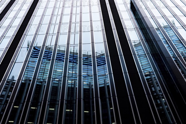 Modern abstract reflections in glass fronted commercial office buildings in the financial district of the British capital London