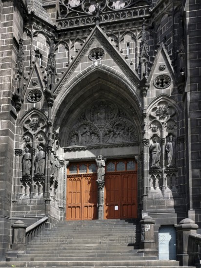 Clermont-Ferrand. The porch of the cathedral Notre-Dame-de-lAssomption. Puy de Dome department. Auvergne Rhone Alpes. France