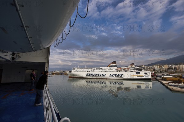 View from a ferry of the harbor with ships and dramatic clouds, Old ferry port in central Patras, Ferries, Patras, Peloponnese, Greece