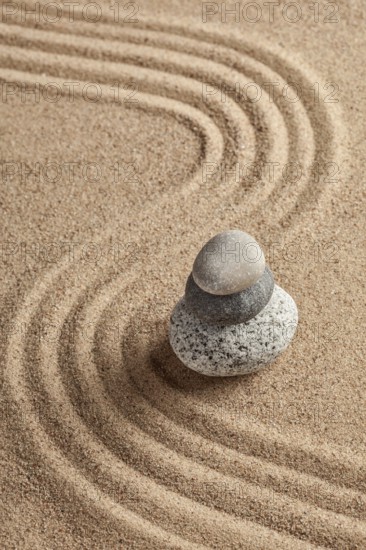 Japanese Zen stone garden, relaxation, meditation, simplicity and balance concept, pebbles and raked sand tranquil calm scene