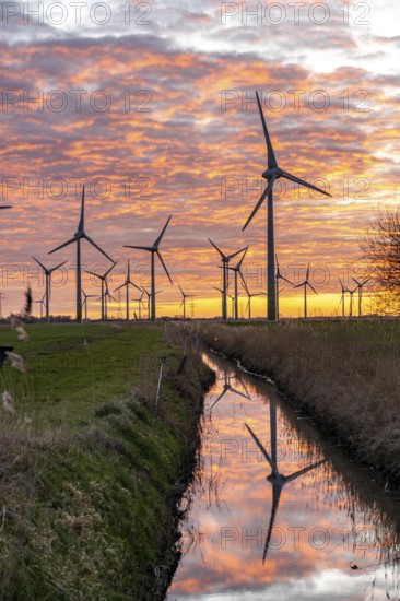 Wind farm near the East Frisian town of Norden, east of the town, sunset, Lower Saxony, Germany