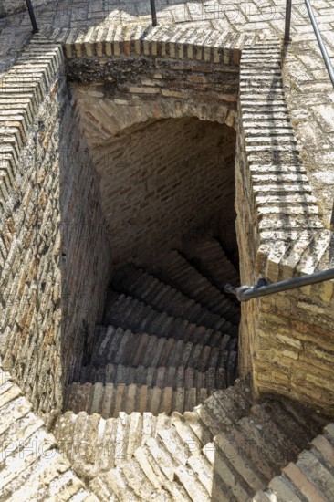 Descending stone staircase made of bricks with rustic charm, Jerez