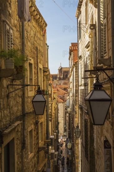 High angle view of narrow street with tourists and visitors in old walled city of Dubrovnik, Croatia
