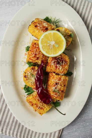 Grilled corn with spices, top view, no people, homemade