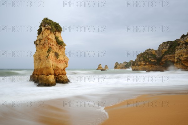 Rocks on the coast in the surf, Praia Dona Ana, Lagos, Algarve, Portugal