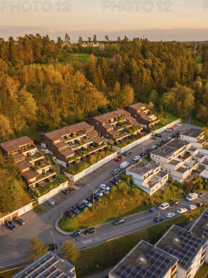 Terraced houses and residential buildings along a road, embedded in a wooded landscape, Nagold, Black Forest, Germany