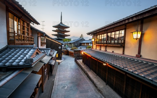 Yasaka dori historic street in the old town with traditional Japanese houses, five-story Yasaka Pagoda of the Buddhist Hokanji Temple at the back, evening mood, blue hour, Higashiyama, Kyoto, Japan