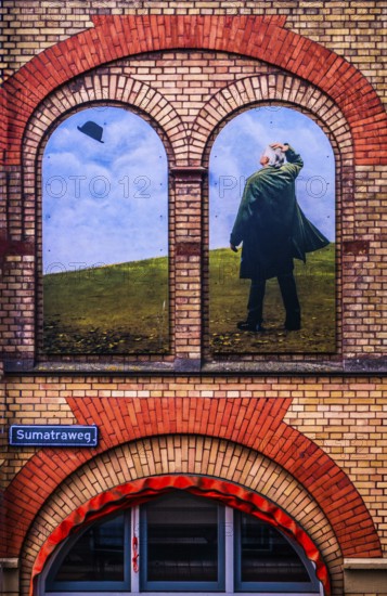 Artistic wall design on the Sumatraweg, scene strongly reminiscent of the surrealist works of René Magritte, city panorama, Rotterdam, the Netherlands