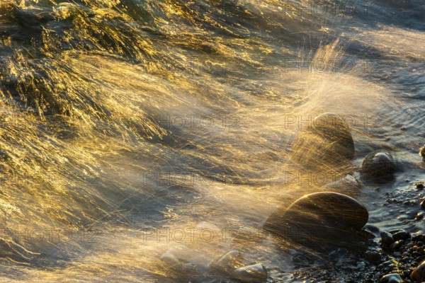 Wave play at sunrise on the chalk coast in Jasmund National Park, Rügen, Sassnitz, Mecklenburg-Western Pomerania, Germany
