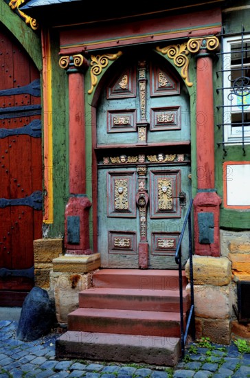 Renaissance door with painted wood carvings in a half-timbered house, historic centre, Alsfeld, Hessen, Germany