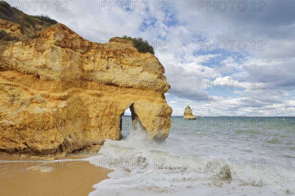 Rocky coast and beach in the surf, Praia do Camilo, Lagos, Algarve, Portugal
