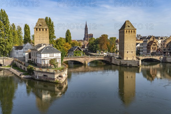 The towers of the Ponts Couverts Covered Bridges on the Ill and the cathedral in Strasbourg, Alsace, France