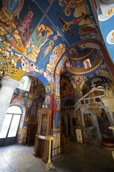 Colourful frescoes of Christ on the ceiling and walls of a 200-year-old church in Lagia, Mani, Laconia, Peloponnese, Greece