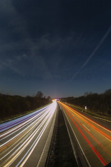 A7 Motorway, Autobahn, beside Kassel at night with light trails from the traffic headlights and taillights, Hesse, Germany