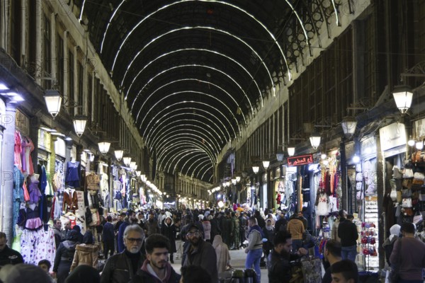Syrians shop at the historic Al-Hamidiyah Bazaar adjacent to the Umayyad Mosque during the early days of Ramadan in Damascus, Syria on February 18, 2026, Damascus, Syria