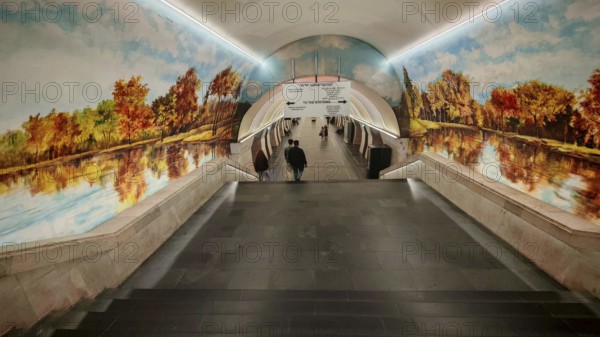 Subway tunnel with murals of trees and water in autumn style, warm atmosphere, Yerevan, Armenia