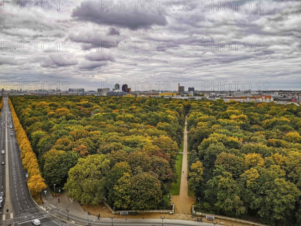 The city of Berlin in autumn with extensive forest and dramatic sky in the background, view from the Victory Column, Berlin
