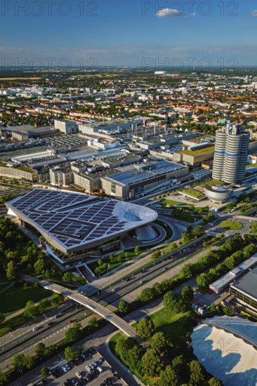 MUNICH, GERMANY, JULY 08, 2018: Aerial view of BMW Museum and BWM Welt and factory and Munich from Olympic Tower. BMW is a famous German luxury car automaker