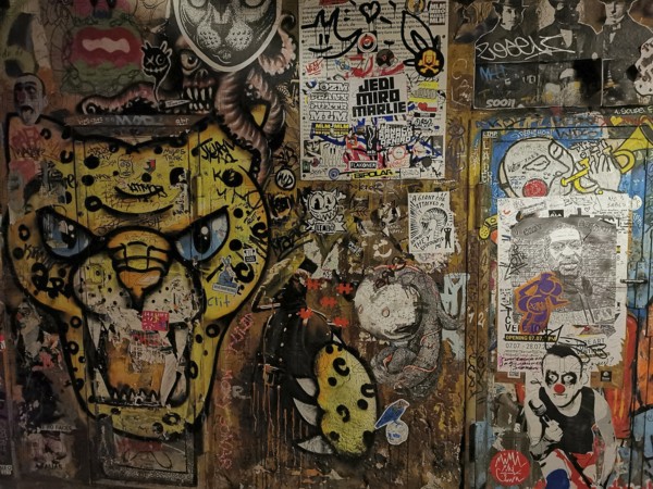 Living wall with leopard graffiti and diverse urban works of art, Berlin