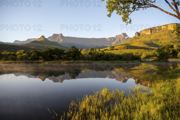 Sunrise, amphitheatre with reflection in the lake, Royal Natal National Park, Drakensberg Mountains south, Kwa Zulu Natal, South Africa