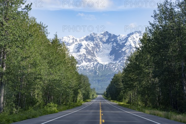 Road through taiga and mountainous landscape, picturesque landscape on Richardson Highway, Alaska, USA