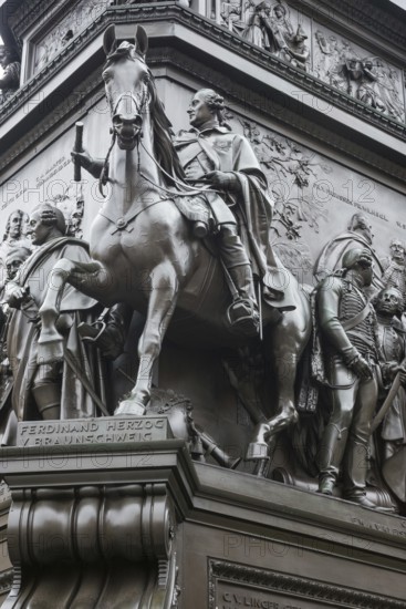 Historical equestrian statue of Frederick the Great at the Forum Fridericianum from 1839-1851, Duke Ferdinand von Braunschweig-Wolfenbüttel in uniform with scroll on a horse with open mouth, artist: Christian Daniel Rauch, Berlin School of Sculpture, transition from classicism to realism, bronze, bronze sculpture, pedestal, portrait, imposing, equestrian monument, equestrian statue, sculpture, detailed historical depiction, Berlin Mitte, City of Berlin, Germany