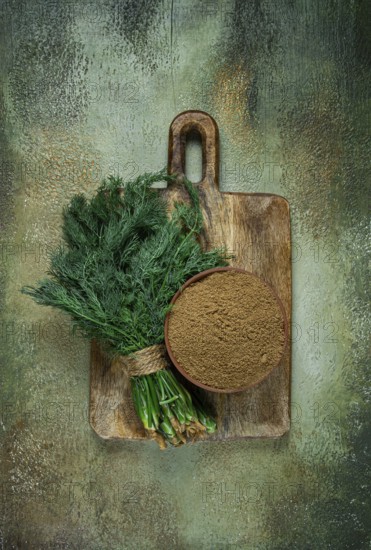 Dried dill, in a ceramic bowl, a bunch of fresh dill, seasoning, top view, no people
