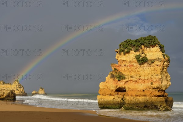 Rocks on beach with rainbow, Praia Dona Ana, Lagos, Algarve, Portugal