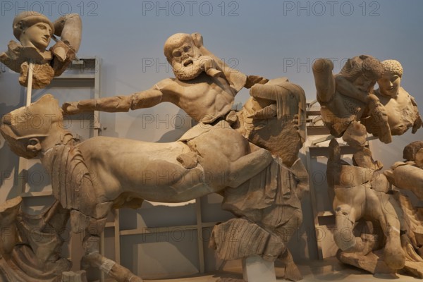 West pediment of the temple of Zeus, battle between lapiths and centaurs, dramatic battle scene in ancient Greek marble sculptures with mythological figures, Olympia Archaeological Museum, Ancient Olympia, Olympia, Peloponnese, Greece