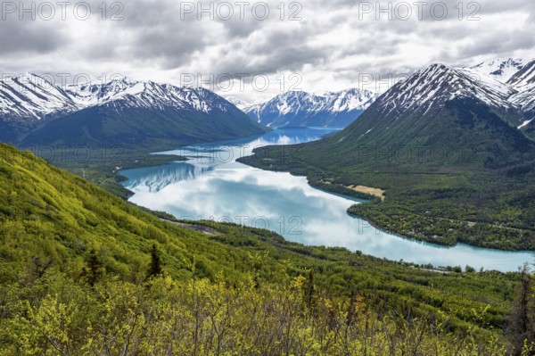 View of snowy mountains and turquoise lake Kenai Lake, Slaughter Ridge Trail, Cooper Landing, Kenai Peninsula, Alaska, USA