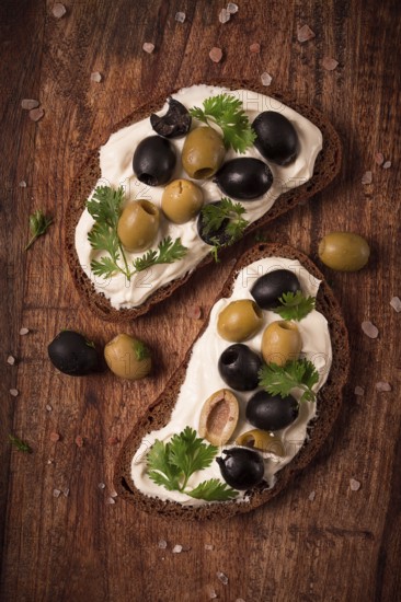 Breakfast, sandwiches, with cream cheese, olives, top view