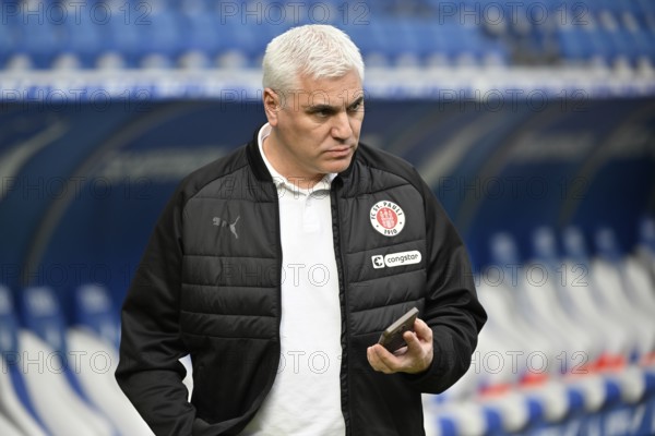 Andreas Bornemann. FC St. Pauli managing director of sports on smartphone mobile soccer Bundesliga, PreZero Arena, Sinsheim, Baden-Württemberg, Germany