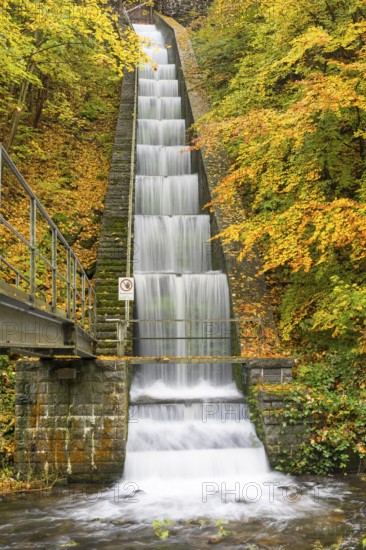 Cascade for power generation at the Rabenauer Grund hydroelectric power plant in autumn, Rote Weisseritz valley, Freital, Saxony, Germany
