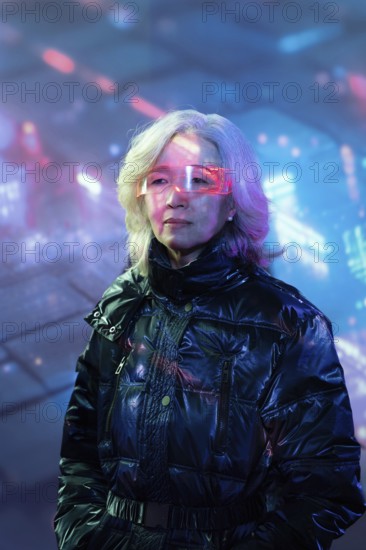 An elderly Asian woman wearing futuristic augmented reality glasses in a vibrant metaverse environment, symbolizing technology integration across generations