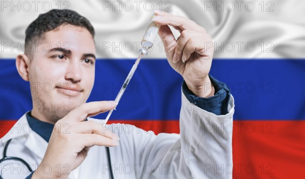 Doctor holding syringe on Russia flag background. Medical professional holding syringe with Russian flag in the background