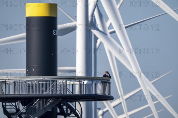 Viewing platform at Landtong Rozenburg wind farm, Noordzeeweg, Paal 83 watchtower 22 meters high, behind it 11 Vestas wind turbines, with an output of 34 MW and an annual result of 117 gigawatts, which corresponds to the consumption of approximately 43, 000 households, on a promontory on Nieuwe Waterweg, at Europoort harbour, hub height 130 meters, rotor diameter 26 meters, near Rotterdam, the Netherlands