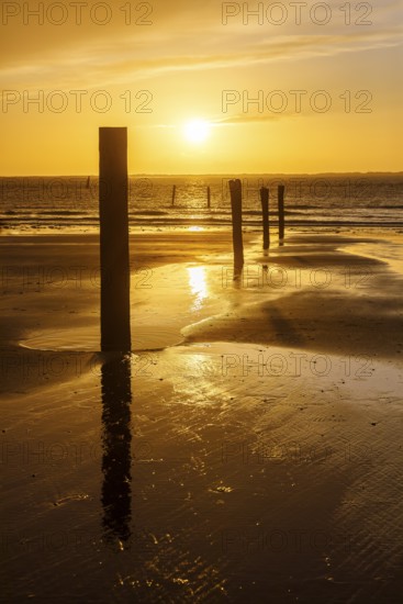 Intense sunset on the west beach of Norderney, Lower Saxony, Germany