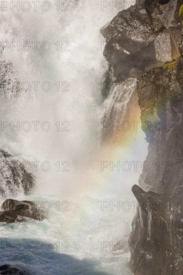 Fossardalur Waterfall with rainbow, close to Djupivogur at the Berufjord, Easter Iceland